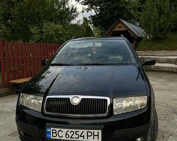 Черный Шкода Фабия, объемом двигателя 1.39 л и пробегом 220 тыс. км за 4650 $, фото 2 на Automoto.ua