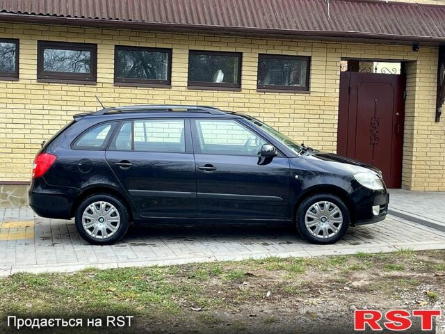 Черный Шкода Фабия, объемом двигателя 1.6 л и пробегом 185 тыс. км за 6100 $, фото 2 на Automoto.ua