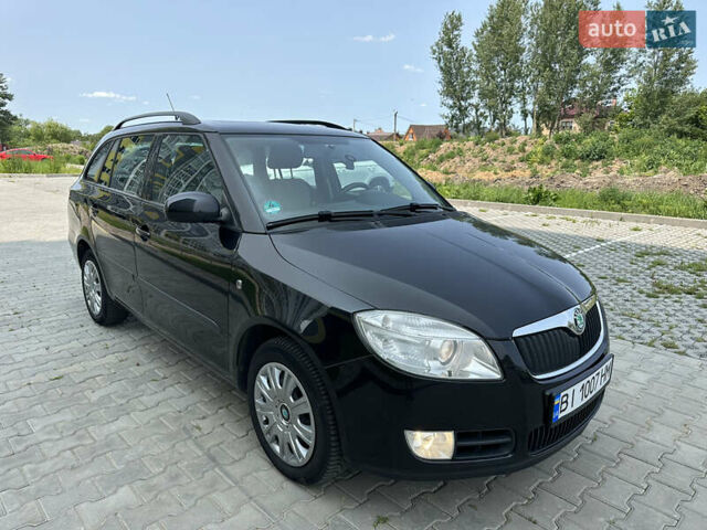 Черный Шкода Фабия, объемом двигателя 1.6 л и пробегом 230 тыс. км за 5999 $, фото 1 на Automoto.ua