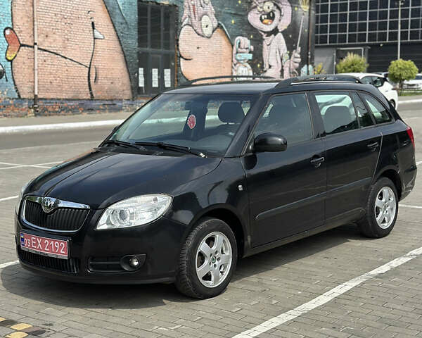 Черный Шкода Фабия, объемом двигателя 1.39 л и пробегом 225 тыс. км за 5650 $, фото 1 на Automoto.ua