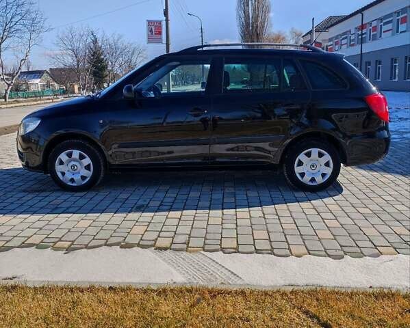Черный Шкода Фабия, объемом двигателя 1.6 л и пробегом 195 тыс. км за 5700 $, фото 7 на Automoto.ua