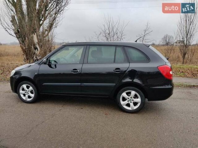Черный Шкода Фабия, объемом двигателя 1.4 л и пробегом 201 тыс. км за 5750 $, фото 1 на Automoto.ua