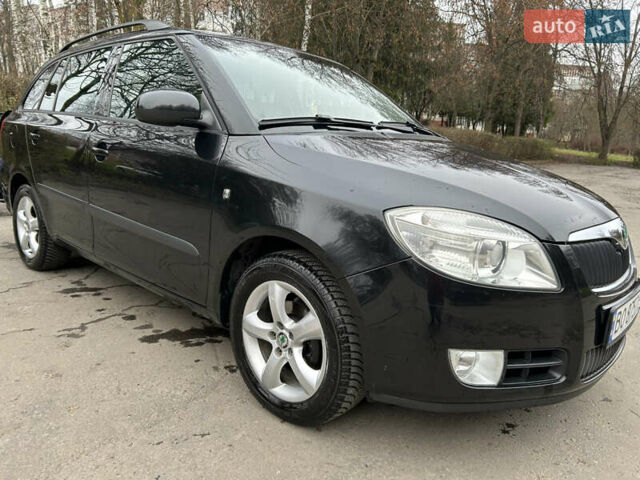 Черный Шкода Фабия, объемом двигателя 1.39 л и пробегом 202 тыс. км за 5750 $, фото 1 на Automoto.ua