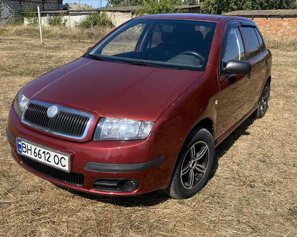 Красный Шкода Фабия, объемом двигателя 1.2 л и пробегом 260 тыс. км за 2950 $, фото 1 на Automoto.ua