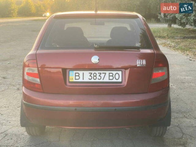 Красный Шкода Фабия, объемом двигателя 1.2 л и пробегом 233 тыс. км за 2950 $, фото 11 на Automoto.ua