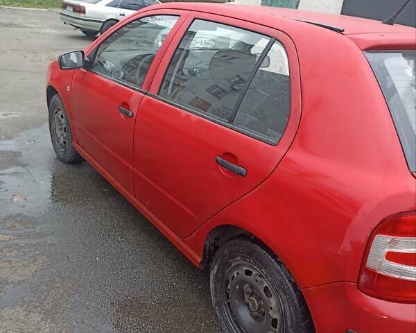 Красный Шкода Фабия, объемом двигателя 1.2 л и пробегом 409 тыс. км за 1800 $, фото 2 на Automoto.ua