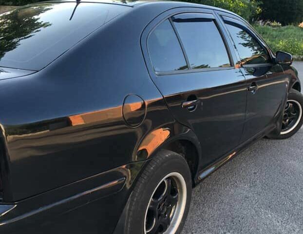 Черный Шкода Октавия, объемом двигателя 1.8 л и пробегом 440 тыс. км за 4800 $, фото 5 на Automoto.ua