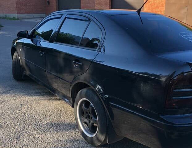 Черный Шкода Октавия, объемом двигателя 1.8 л и пробегом 440 тыс. км за 4800 $, фото 4 на Automoto.ua