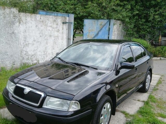 Черный Шкода Октавия, объемом двигателя 1.6 л и пробегом 230 тыс. км за 5500 $, фото 1 на Automoto.ua
