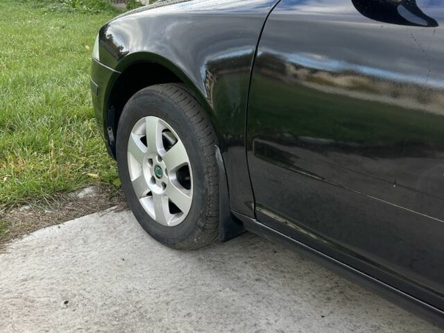 Черный Шкода Октавия, объемом двигателя 2 л и пробегом 330 тыс. км за 4250 $, фото 5 на Automoto.ua