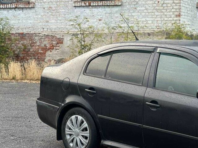 Черный Шкода Октавия, объемом двигателя 1.6 л и пробегом 255 тыс. км за 3200 $, фото 1 на Automoto.ua