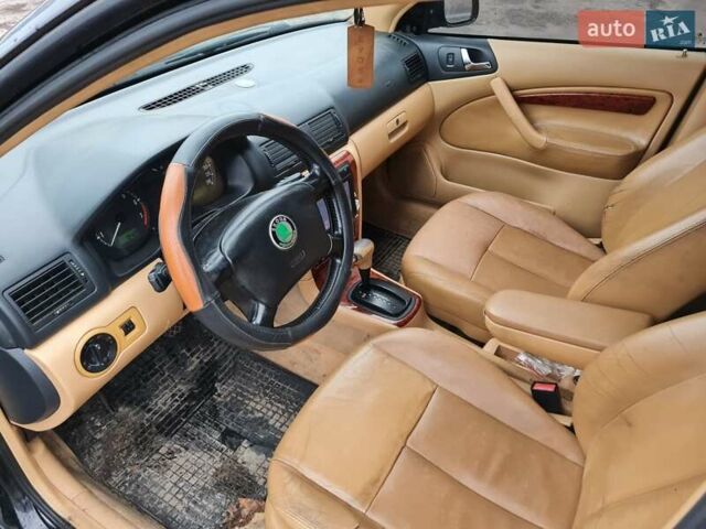 Черный Шкода Октавия, объемом двигателя 1.8 л и пробегом 370 тыс. км за 3500 $, фото 5 на Automoto.ua