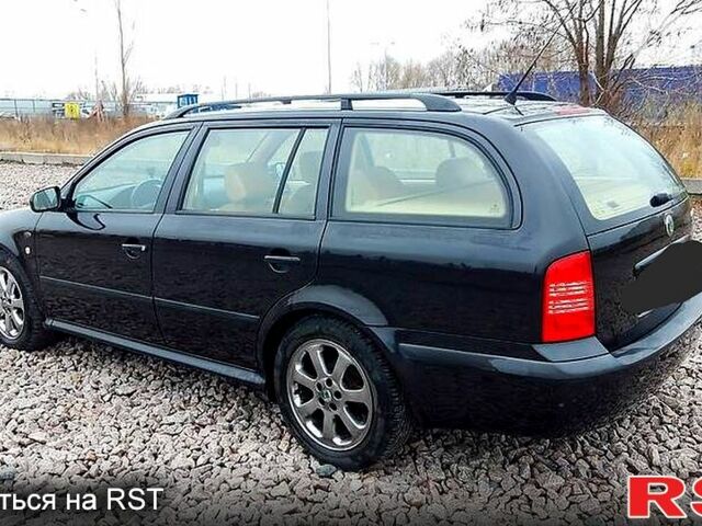 Черный Шкода Октавия, объемом двигателя 1.8 л и пробегом 270 тыс. км за 4500 $, фото 3 на Automoto.ua