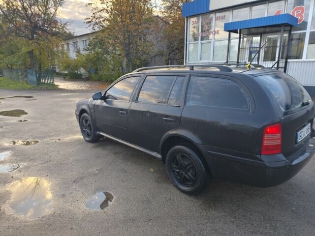Черный Шкода Октавия, объемом двигателя 1 л и пробегом 302 тыс. км за 1600 $, фото 3 на Automoto.ua
