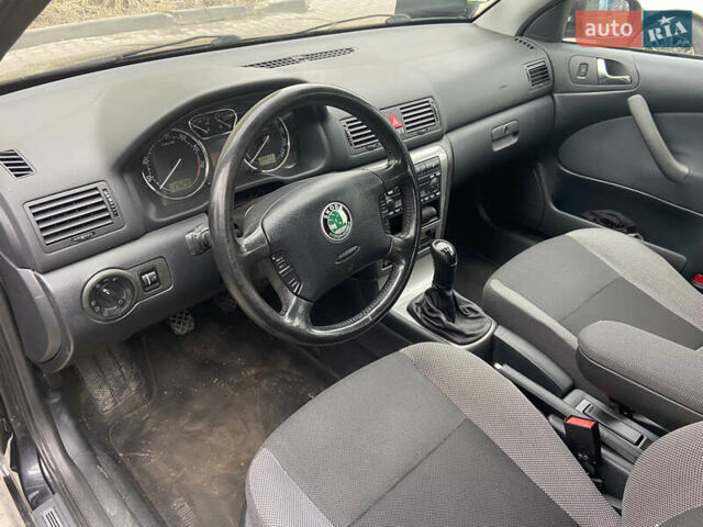 Черный Шкода Октавия, объемом двигателя 1.6 л и пробегом 210 тыс. км за 5600 $, фото 7 на Automoto.ua