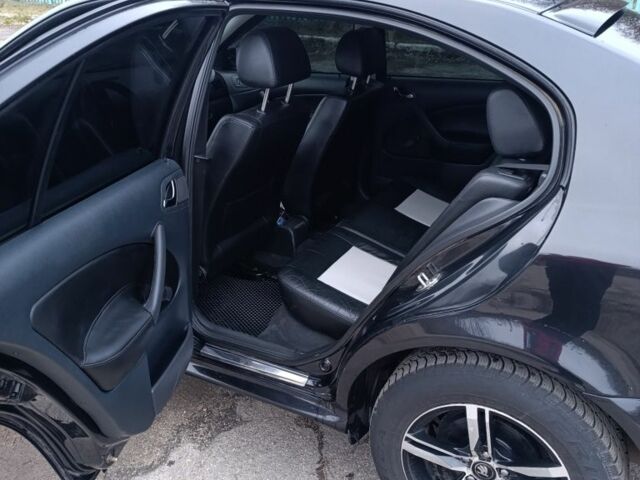 Черный Шкода Октавия, объемом двигателя 1 л и пробегом 256 тыс. км за 5300 $, фото 5 на Automoto.ua