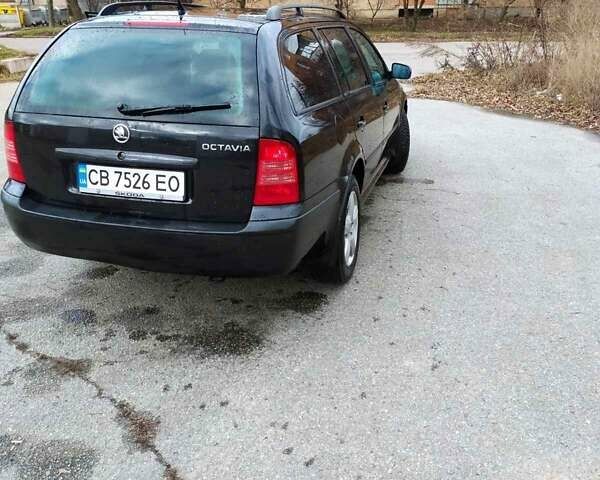 Черный Шкода Октавия, объемом двигателя 1.6 л и пробегом 255 тыс. км за 5500 $, фото 1 на Automoto.ua