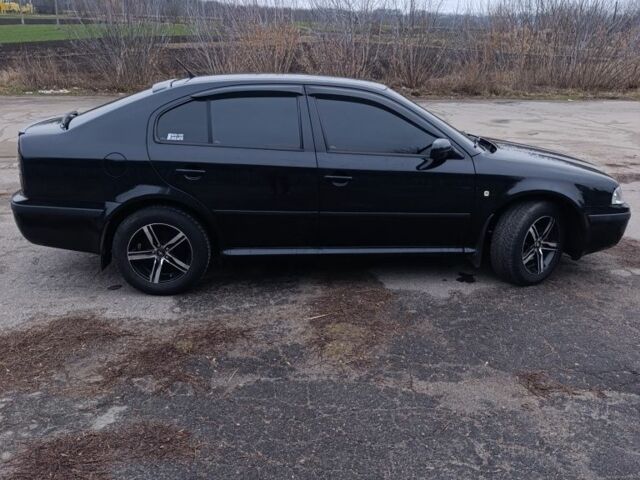 Черный Шкода Октавия, объемом двигателя 1 л и пробегом 256 тыс. км за 5300 $, фото 2 на Automoto.ua