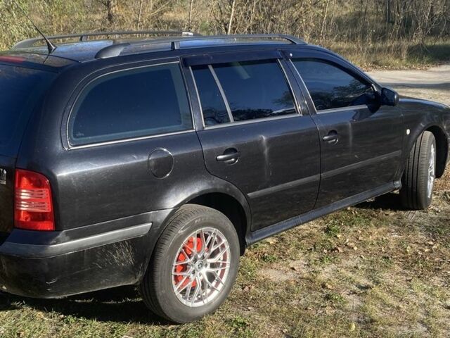 Черный Шкода Октавия, объемом двигателя 1.6 л и пробегом 297 тыс. км за 4500 $, фото 7 на Automoto.ua