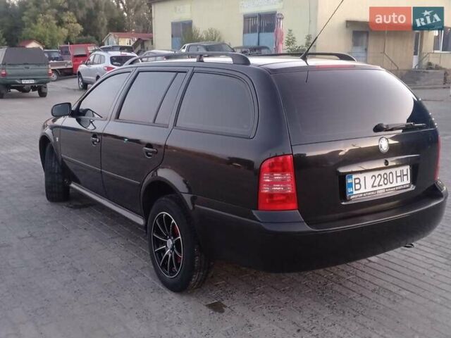 Черный Шкода Октавия, объемом двигателя 1.6 л и пробегом 201 тыс. км за 5800 $, фото 2 на Automoto.ua