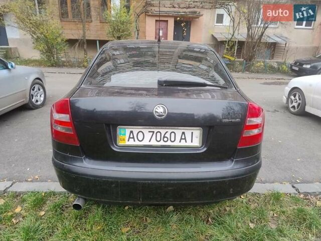 Черный Шкода Октавия, объемом двигателя 1.6 л и пробегом 303 тыс. км за 3900 $, фото 2 на Automoto.ua
