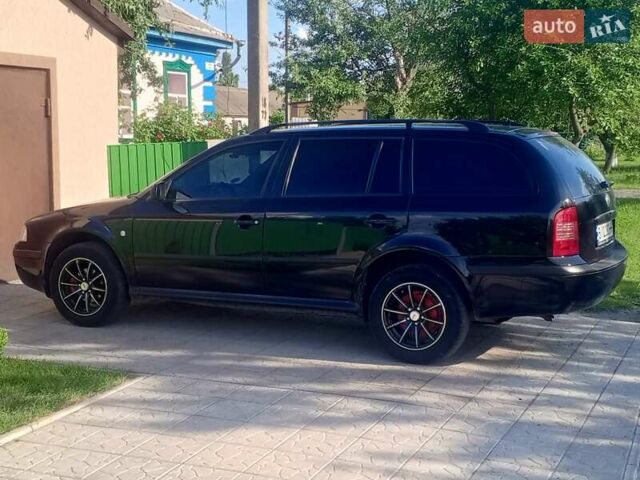 Черный Шкода Октавия, объемом двигателя 1.6 л и пробегом 201 тыс. км за 5800 $, фото 7 на Automoto.ua