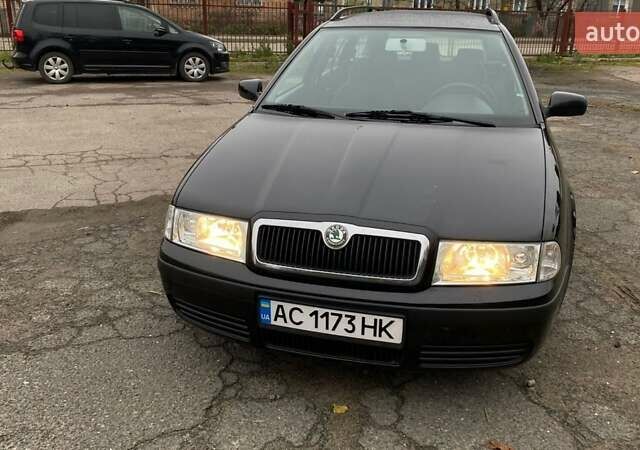 Черный Шкода Октавия, объемом двигателя 1.6 л и пробегом 206 тыс. км за 6300 $, фото 1 на Automoto.ua