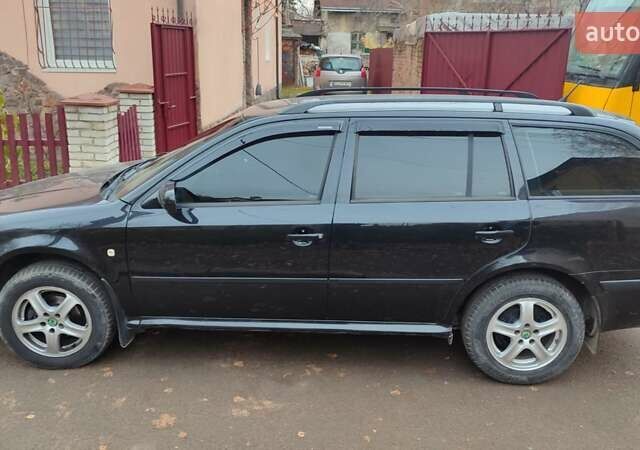 Черный Шкода Октавия, объемом двигателя 1.6 л и пробегом 200 тыс. км за 5500 $, фото 9 на Automoto.ua