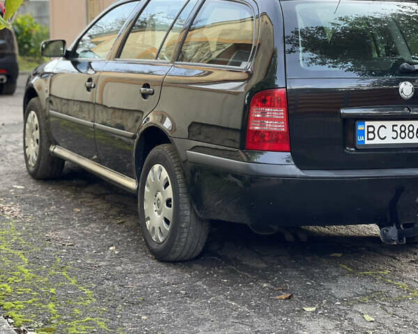 Черный Шкода Октавия, объемом двигателя 1.6 л и пробегом 217 тыс. км за 5700 $, фото 1 на Automoto.ua