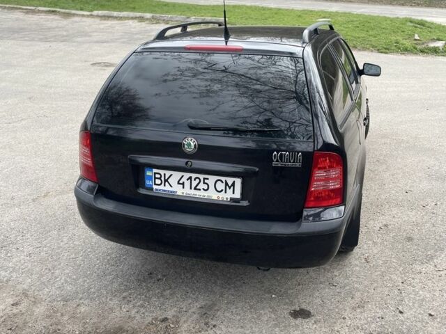 Черный Шкода Октавия, объемом двигателя 1.6 л и пробегом 201 тыс. км за 5650 $, фото 16 на Automoto.ua