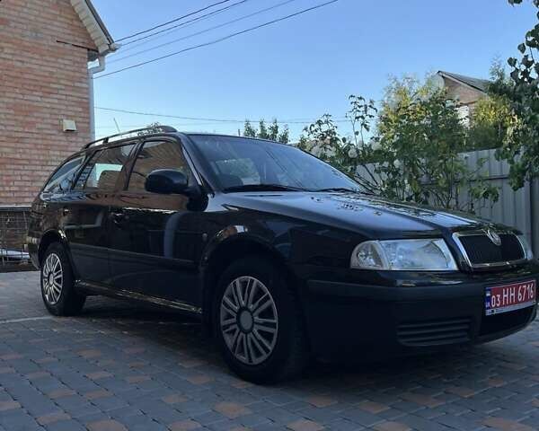 Черный Шкода Октавия, объемом двигателя 1.6 л и пробегом 198 тыс. км за 6700 $, фото 2 на Automoto.ua