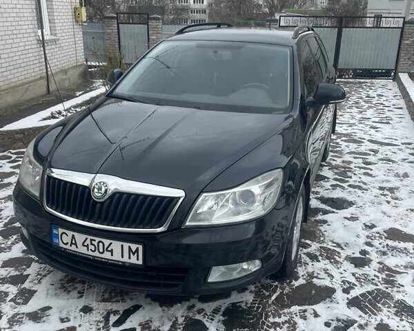 Черный Шкода Октавия, объемом двигателя 1.6 л и пробегом 325 тыс. км за 8500 $, фото 1 на Automoto.ua