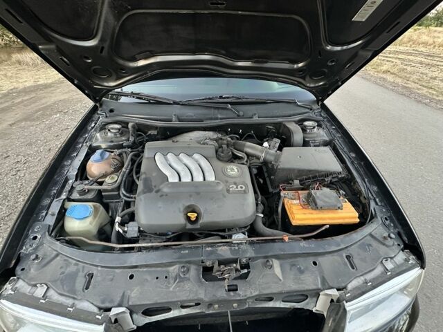 Черный Шкода Октавия, объемом двигателя 2 л и пробегом 260 тыс. км за 4800 $, фото 4 на Automoto.ua