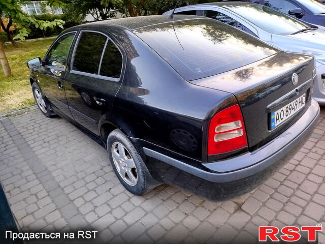Черный Шкода Октавия, объемом двигателя 1.8 л и пробегом 345 тыс. км за 3300 $, фото 1 на Automoto.ua