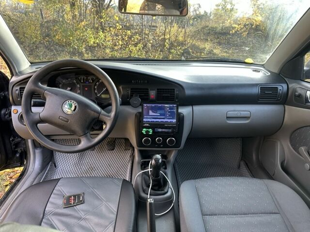 Черный Шкода Октавия, объемом двигателя 1.6 л и пробегом 348 тыс. км за 4200 $, фото 7 на Automoto.ua