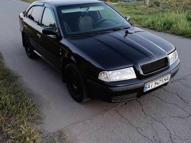 Черный Шкода Октавия, объемом двигателя 2 л и пробегом 320 тыс. км за 3450 $, фото 2 на Automoto.ua
