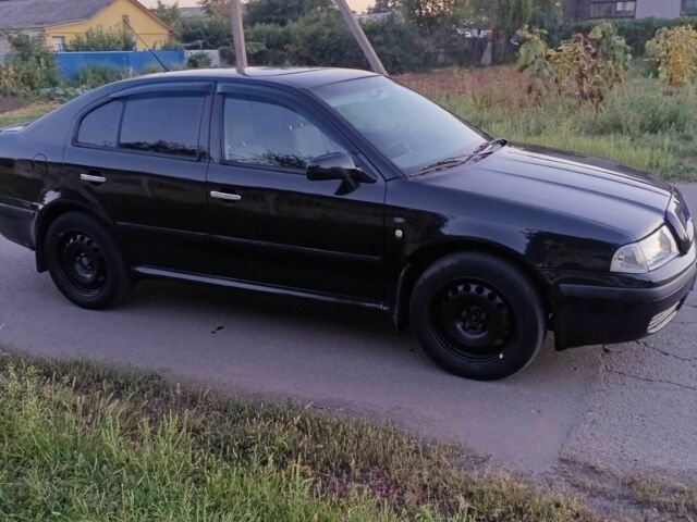 Черный Шкода Октавия, объемом двигателя 2 л и пробегом 320 тыс. км за 3450 $, фото 1 на Automoto.ua