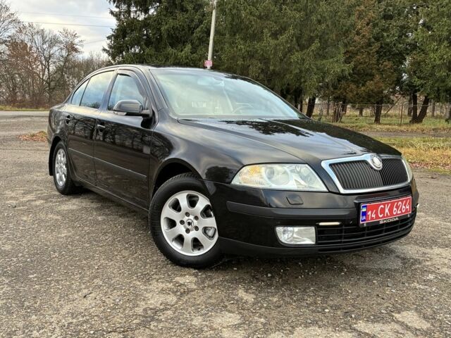 Черный Шкода Октавия, объемом двигателя 1.6 л и пробегом 180 тыс. км за 5750 $, фото 1 на Automoto.ua
