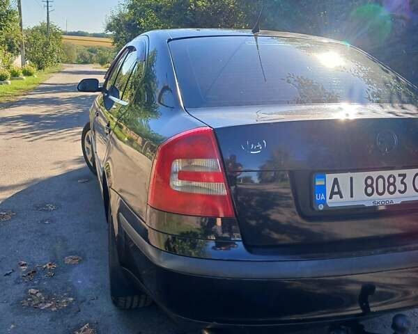 Черный Шкода Октавия, объемом двигателя 1.6 л и пробегом 288 тыс. км за 4700 $, фото 1 на Automoto.ua
