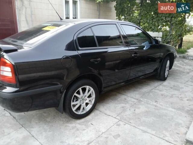 Черный Шкода Октавия, объемом двигателя 1.8 л и пробегом 320 тыс. км за 5600 $, фото 2 на Automoto.ua