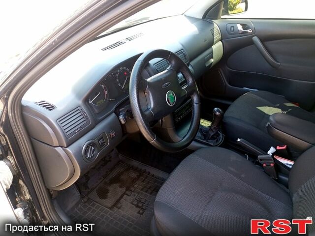 Чорний Шкода Октавія, об'ємом двигуна 1.8 л та пробігом 345 тис. км за 5700 $, фото 7 на Automoto.ua