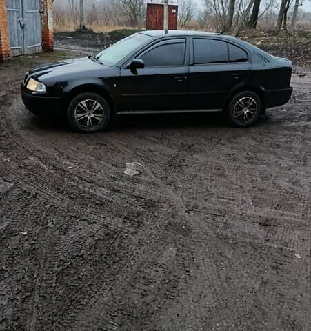 Черный Шкода Октавия, объемом двигателя 1.6 л и пробегом 175 тыс. км за 5750 $, фото 1 на Automoto.ua