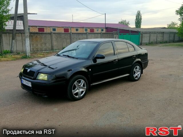 Черный Шкода Октавия, объемом двигателя 1.6 л и пробегом 220 тыс. км за 5250 $, фото 1 на Automoto.ua