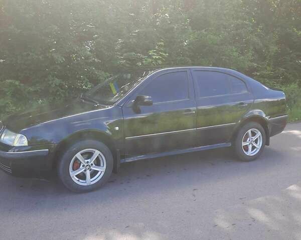 Чорний Шкода Октавія, об'ємом двигуна 1.6 л та пробігом 230 тис. км за 4400 $, фото 1 на Automoto.ua