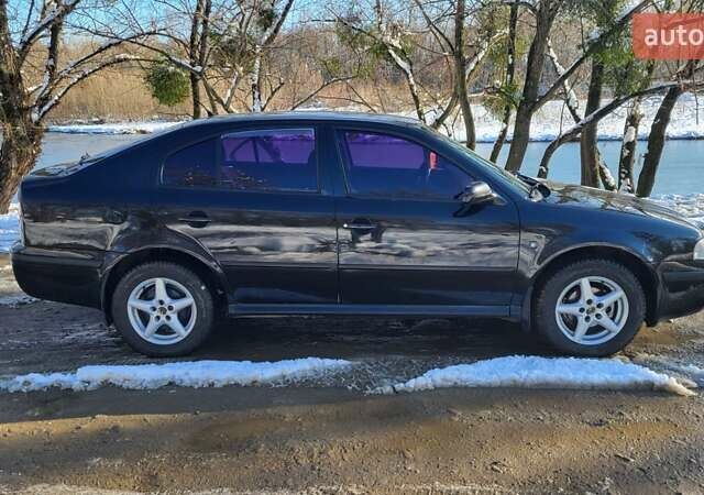 Черный Шкода Октавия, объемом двигателя 1.6 л и пробегом 230 тыс. км за 4800 $, фото 10 на Automoto.ua