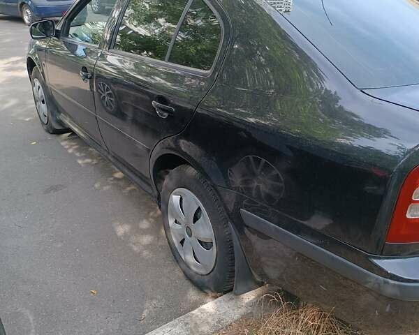 Черный Шкода Октавия, объемом двигателя 1.6 л и пробегом 431 тыс. км за 5500 $, фото 12 на Automoto.ua