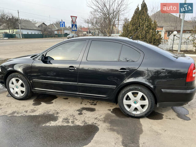 Черный Шкода Октавия, объемом двигателя 1.6 л и пробегом 216 тыс. км за 7600 $, фото 1 на Automoto.ua