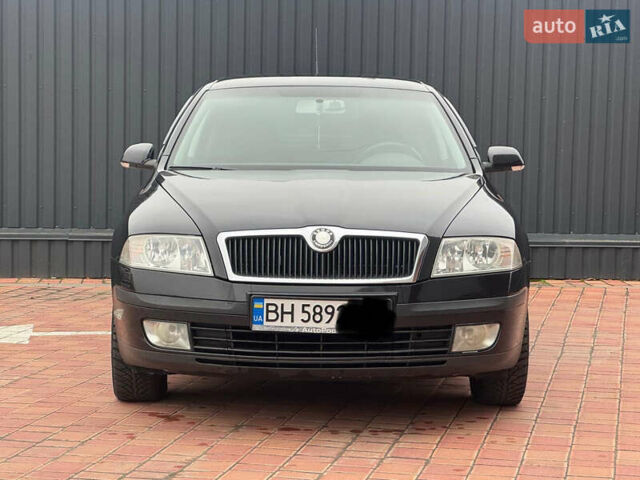 Черный Шкода Октавия, объемом двигателя 2 л и пробегом 230 тыс. км за 6950 $, фото 2 на Automoto.ua