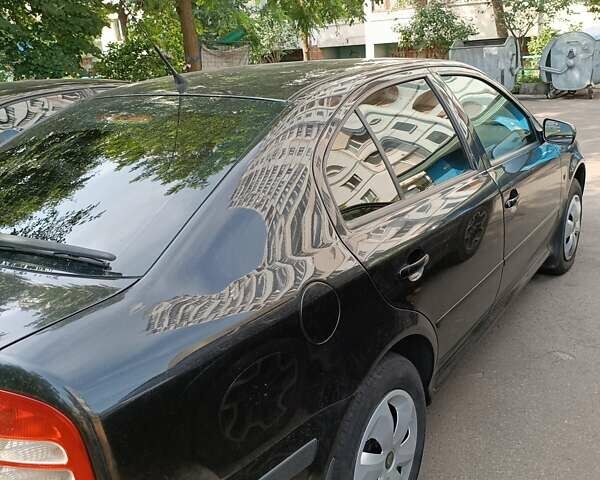 Черный Шкода Октавия, объемом двигателя 1.6 л и пробегом 431 тыс. км за 5500 $, фото 11 на Automoto.ua