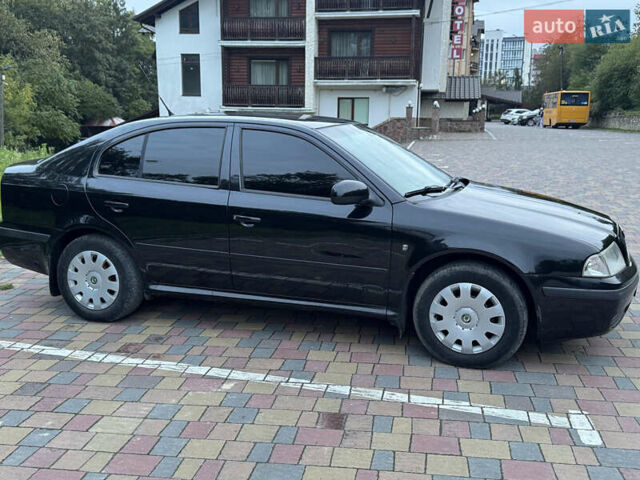 Черный Шкода Октавия, объемом двигателя 1.6 л и пробегом 225 тыс. км за 5650 $, фото 2 на Automoto.ua